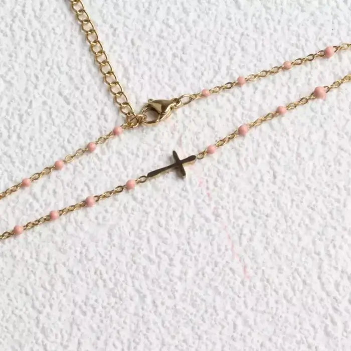 Collier croix perles roses