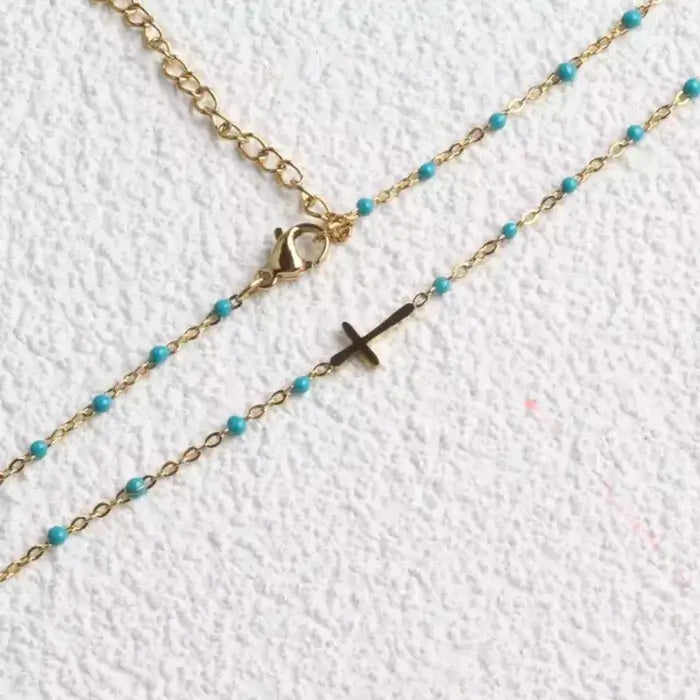 Collier croix perles turquoises