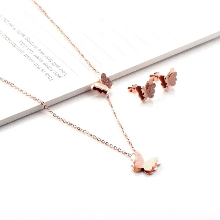 Collier et boucles d'oreilles papillon Or rose sur support