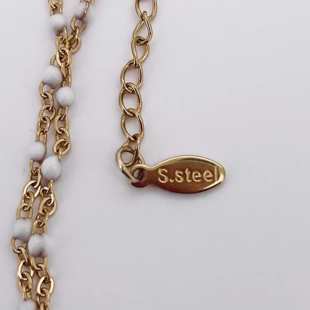 Bracelet Gigi Clozeau doré avec perles de couleurs ssteel