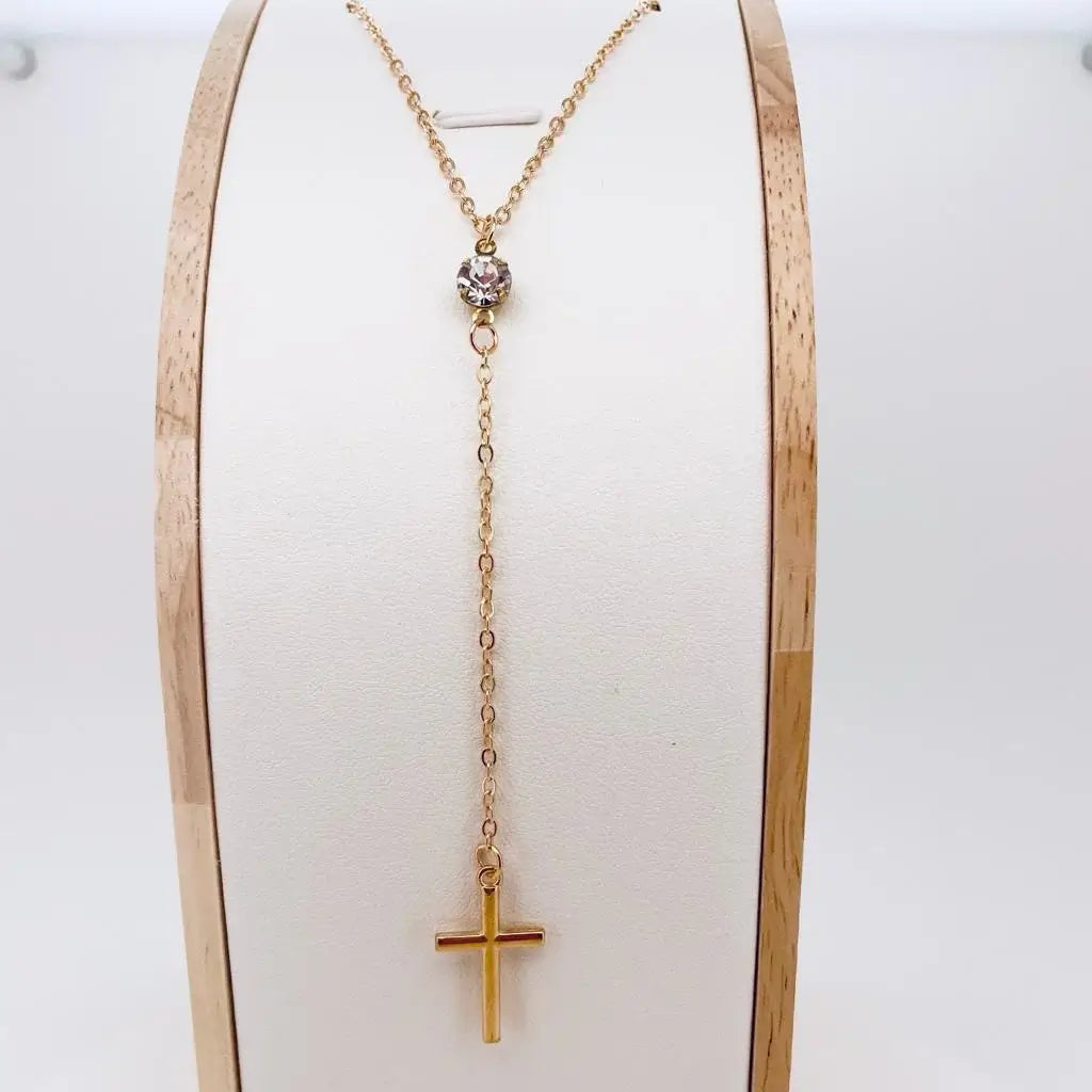 Collier croix pendante et pierre de zircon or support