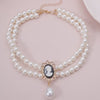 Collier ras de cou avec pendentif dame aux camélias vidéo