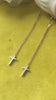 Boucles d'oreilles croix traversantes en argent video