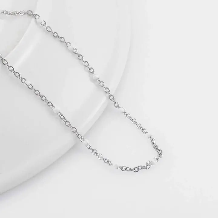 Bracelets Gigi Clozeau argenté avec perles de couleur blanche
