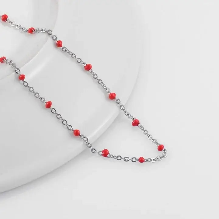 Bracelets Gigi Clozeau argenté avec perles de couleur rouge